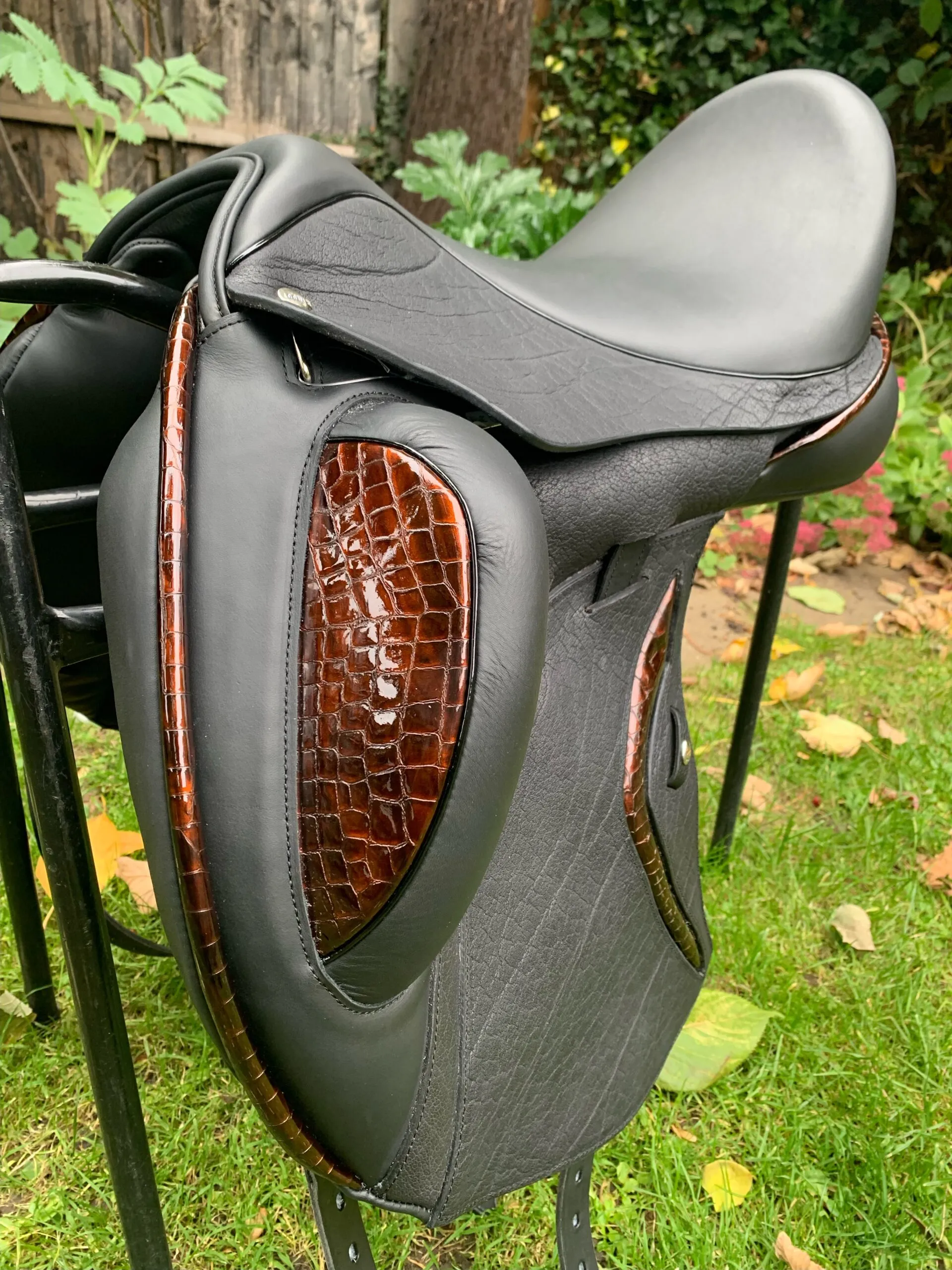 A bespoke IDEAL Iconix dressage saddle made to order, with hand-finished crocodile-patterned leather inlays